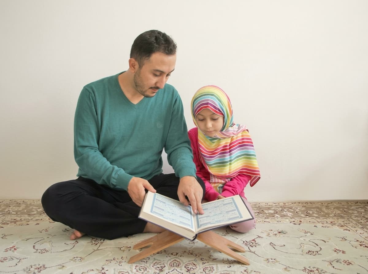 Father supporting his daughter as they read the Quran together